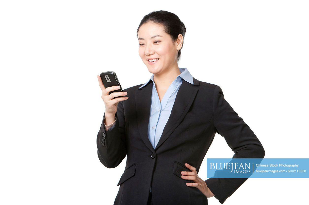Chinese businesswoman using mobile phone