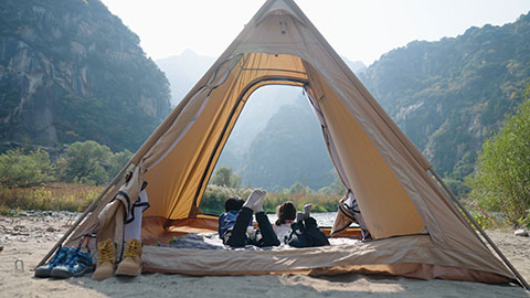 Cute Chinese Children looking out from tent