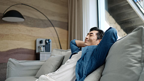 Mid adult Chinese man relaxing at home,4K