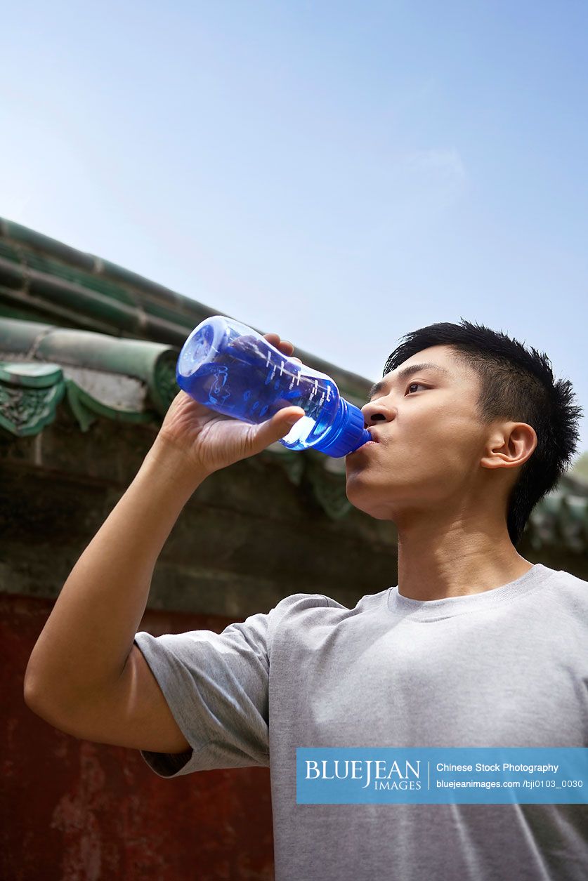 Chinese Athlete Having A Drink