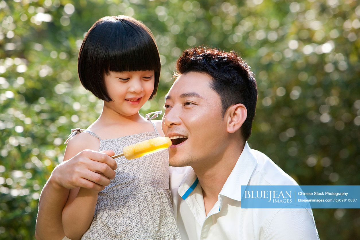Tender moment between Chinese father and daughter
