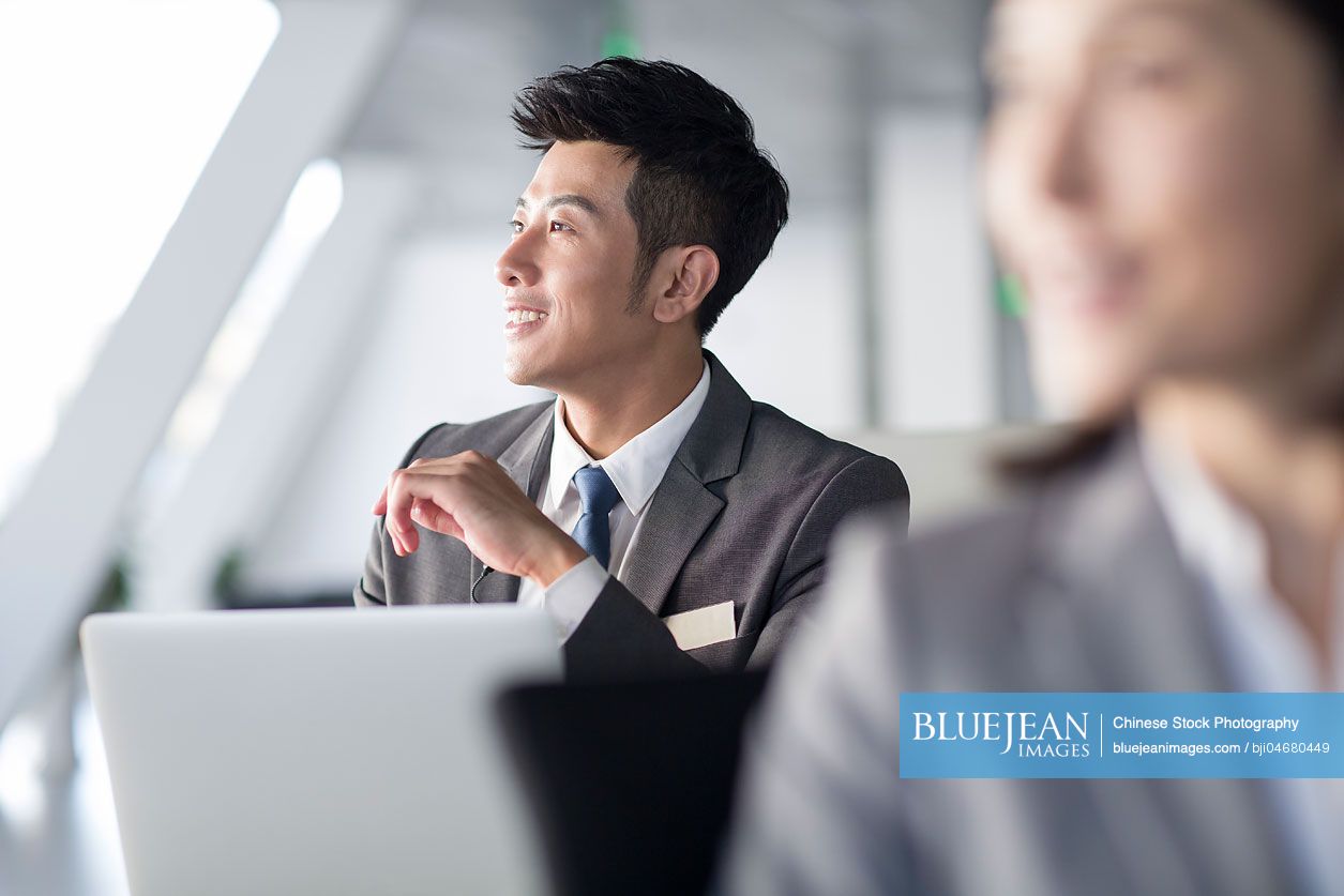 Chinese business person sitting in office