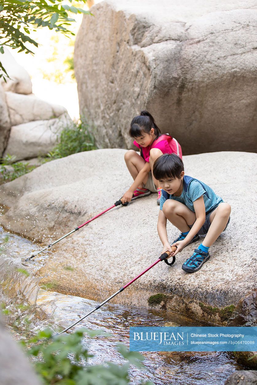 Little Chinese children having fun outdoors