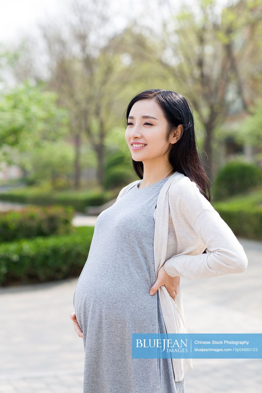 Happy pregnant Chinese woman