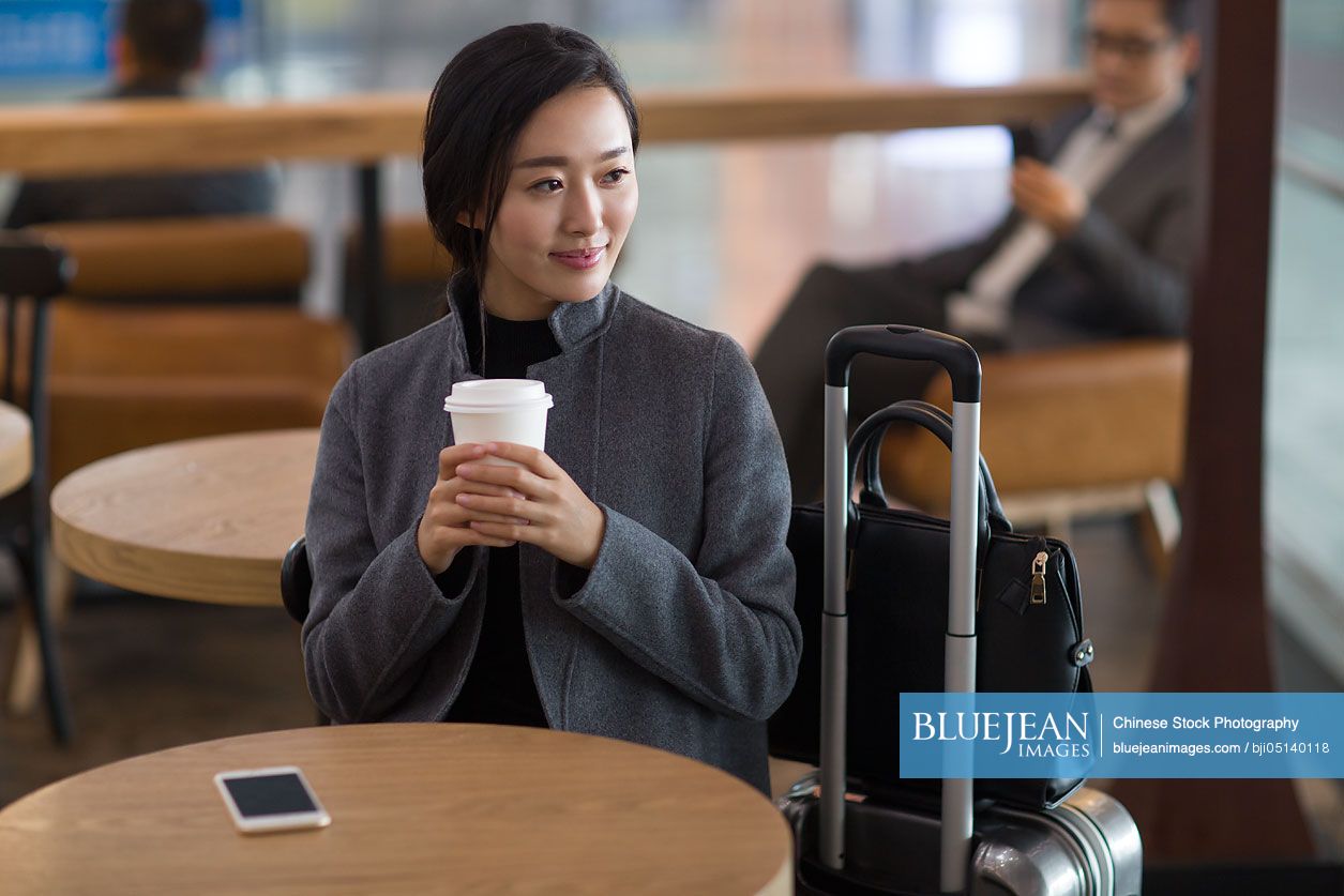 Chinese businesswoman waiting in airport