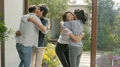 Young Chinese couple welcoming guests for party,4K