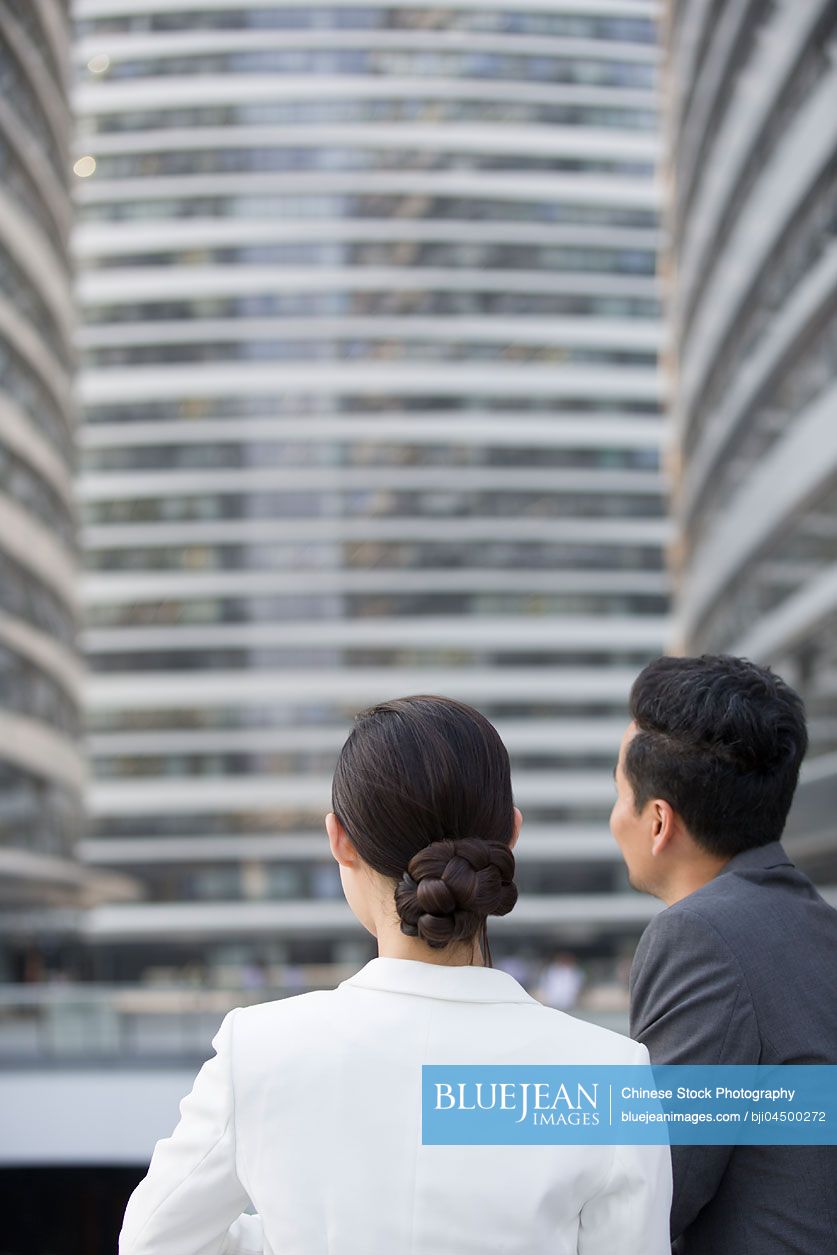 Chinese business person looking at view