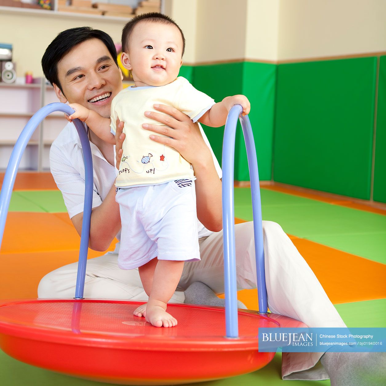 Chinese father playing with son