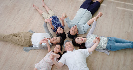Happy Chinese family lying on floor in a circle,4K