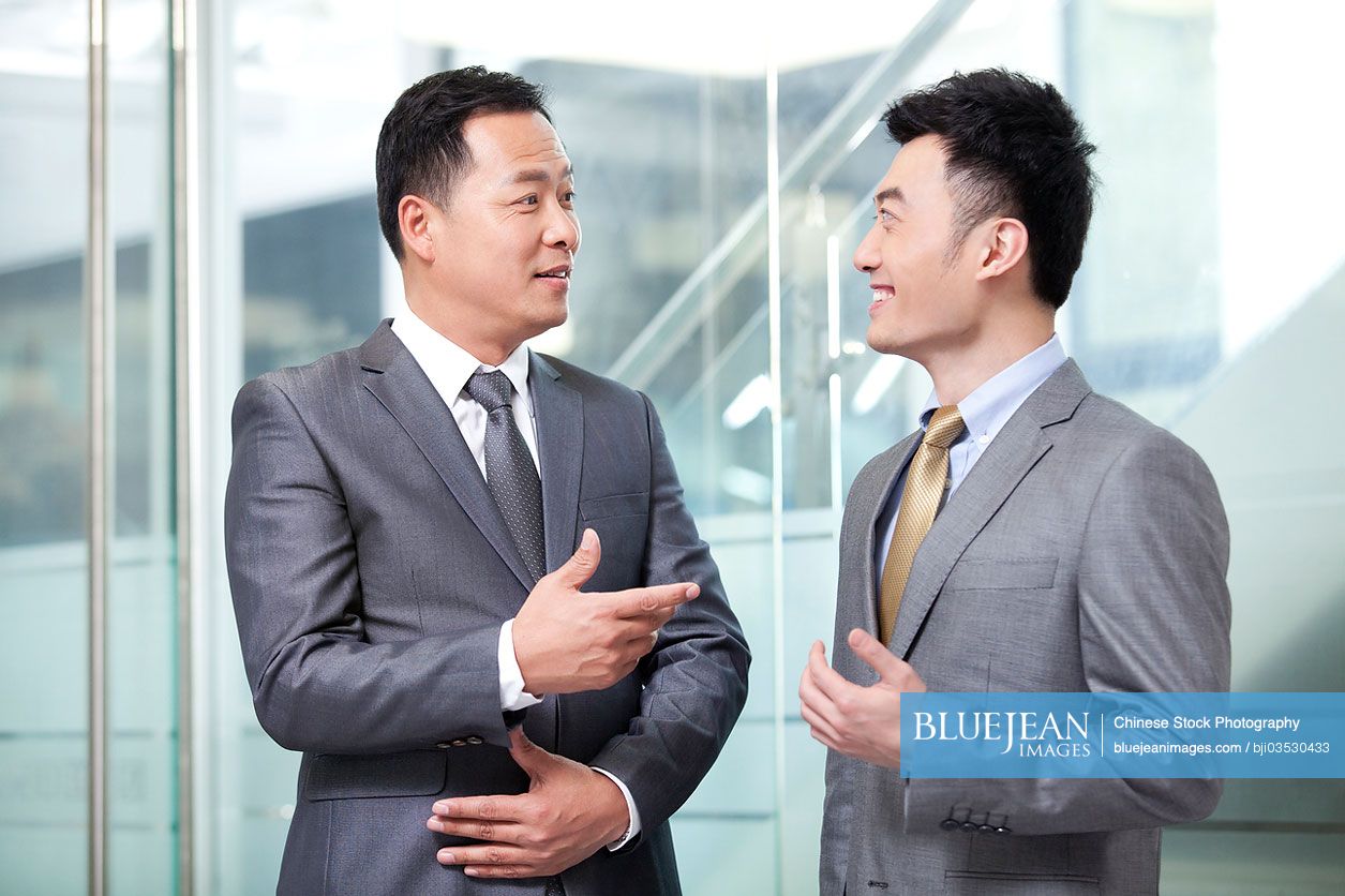 Chinese business partners in discussion