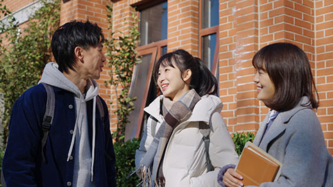 Happy Chinese college students chatting