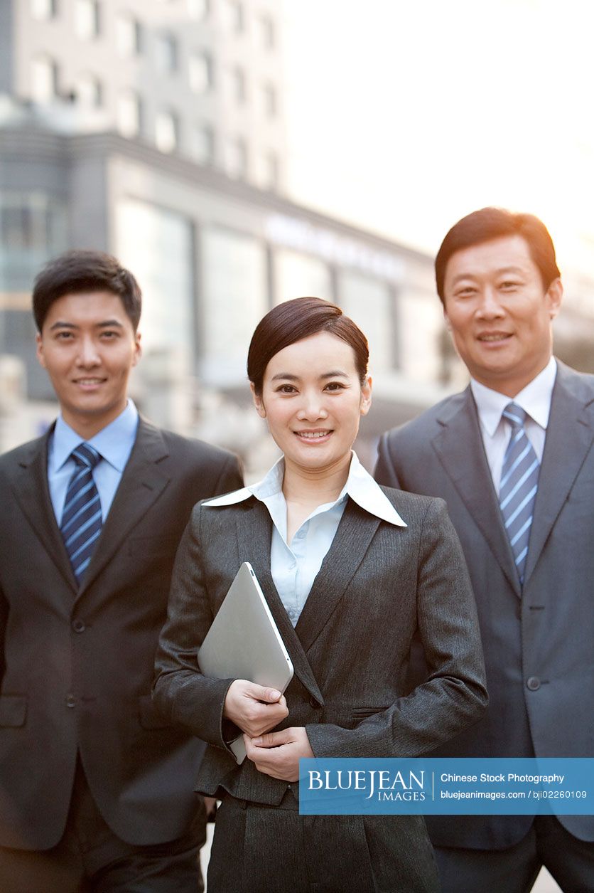 Group of happy Chinese business colleagues