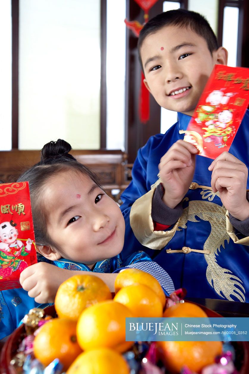 Traditionally dressed Chinese children celebrating Chinese New Year