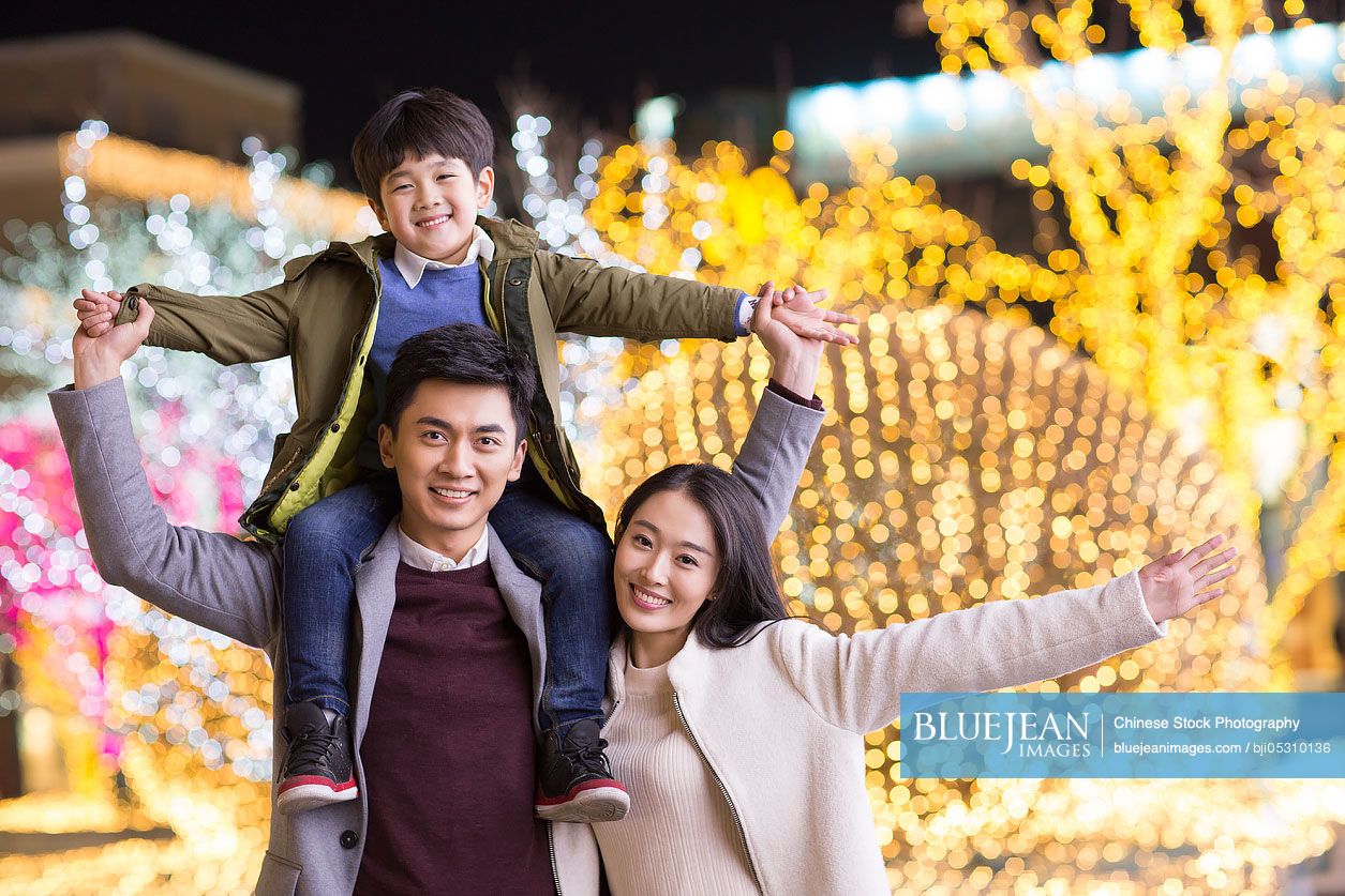 Portrait of cheerful young Chinese family