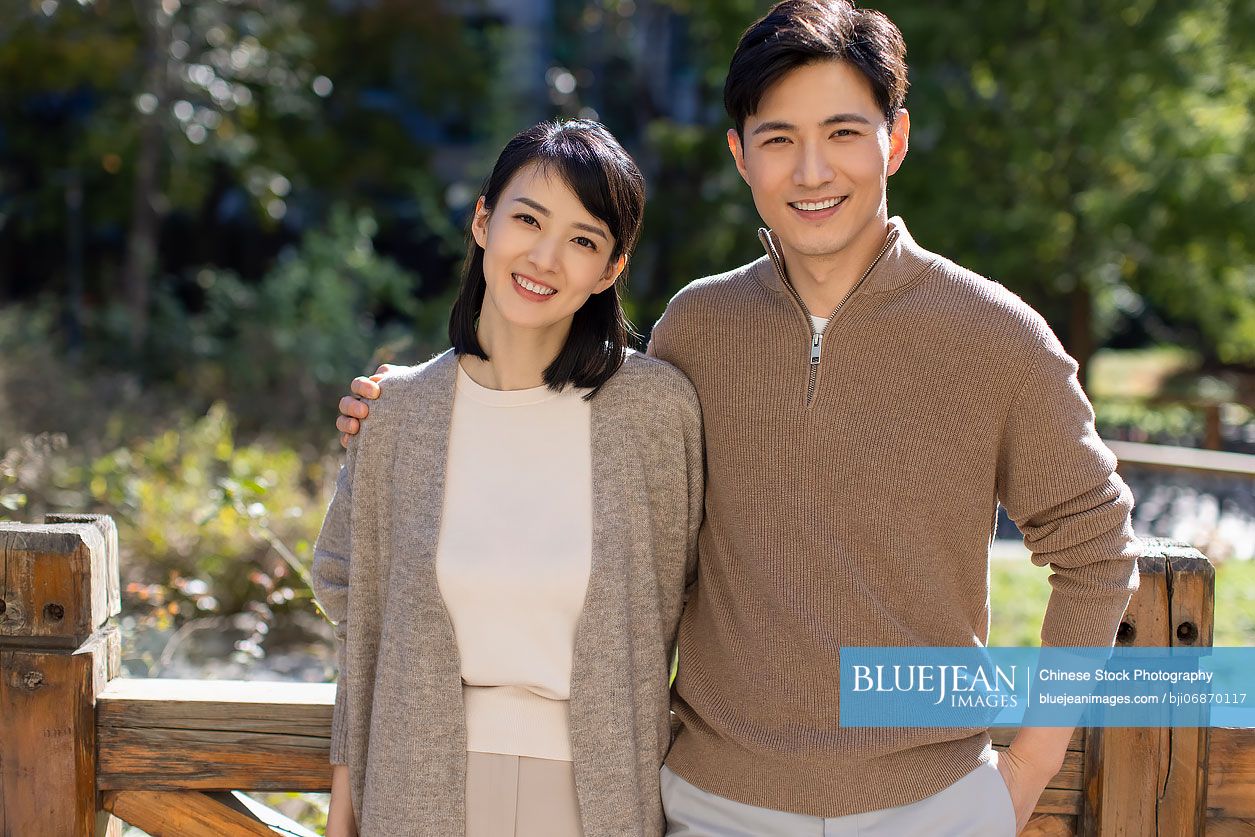 Portrait of cheerful young Chinese couple