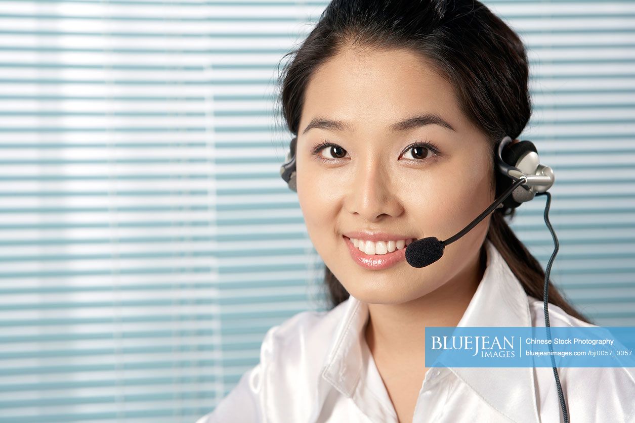 Chinese Woman Wearing A Headset