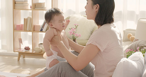 Young Chinese mom holding baby girl,4K