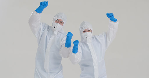 Chinese medical workers in protective suit doing high five,4K