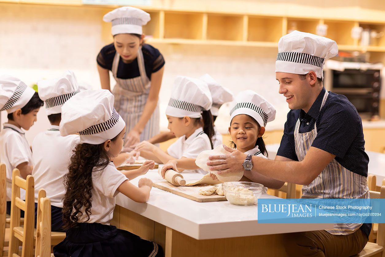 Children learning cooking in classroom