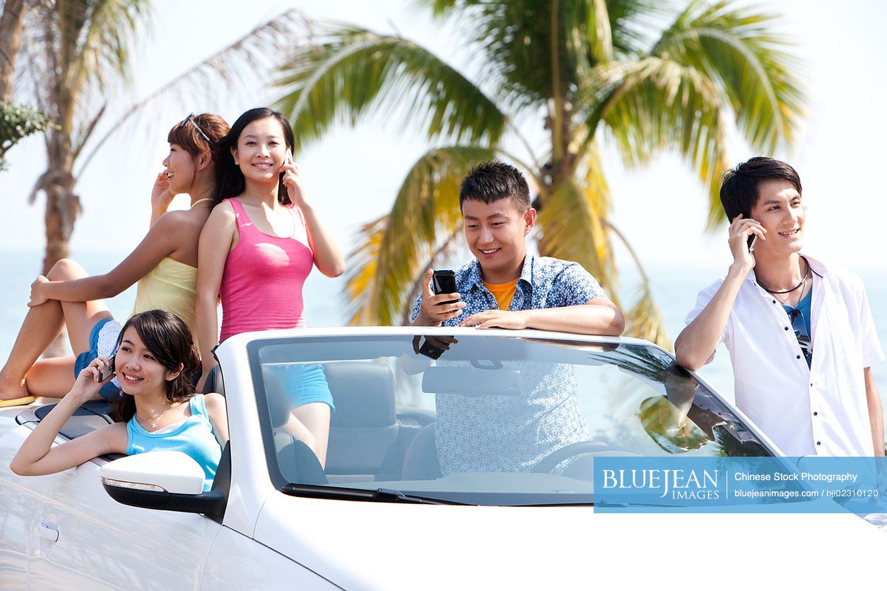 Chinese friends on mobile phones high res stock photo for download