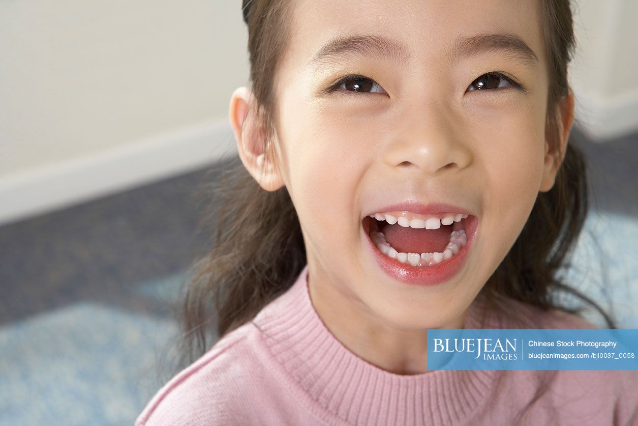 Chinese Girl Laughing In Classroom