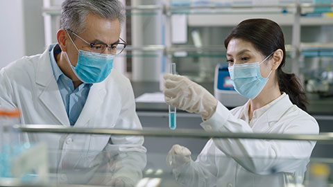 Chinese scientists examining medical sample in laboratory,4K