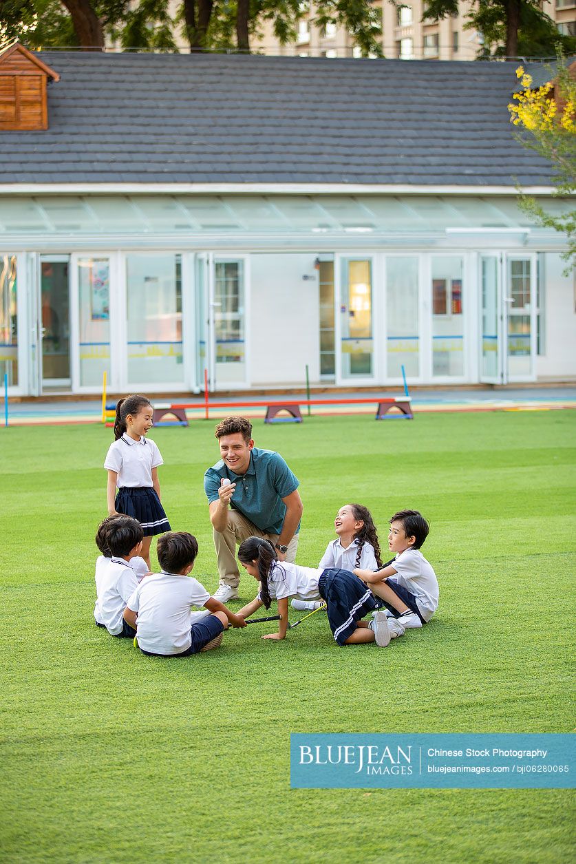Foreign teacher teaching golf