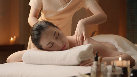Young Chinese woman receiving massage at spa center,4K