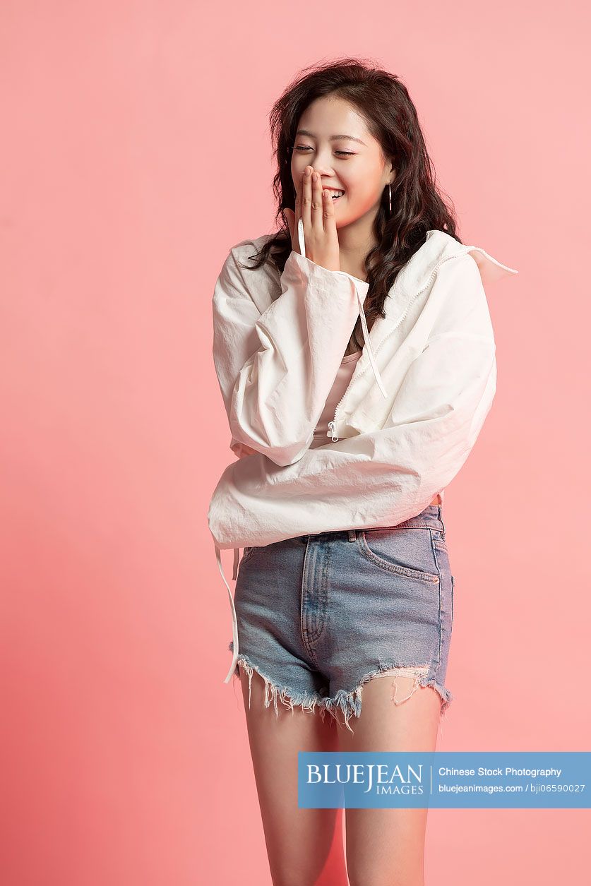 Studio shot of cute young Chinese woman