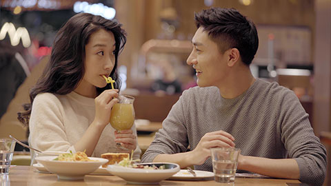 Happy young Chinese couple dating in restaurant,4K