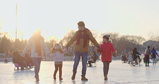 Happy young Chinese family walking on ice,4K