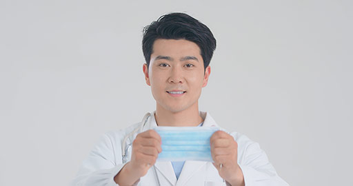 Young Chinese doctor wearing surgical mask,4K