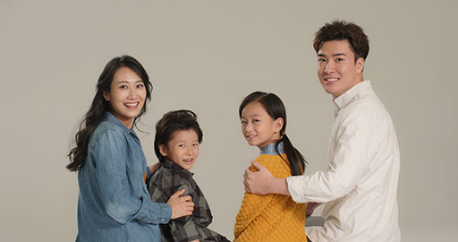 Happy young Chinese family smiling,4K