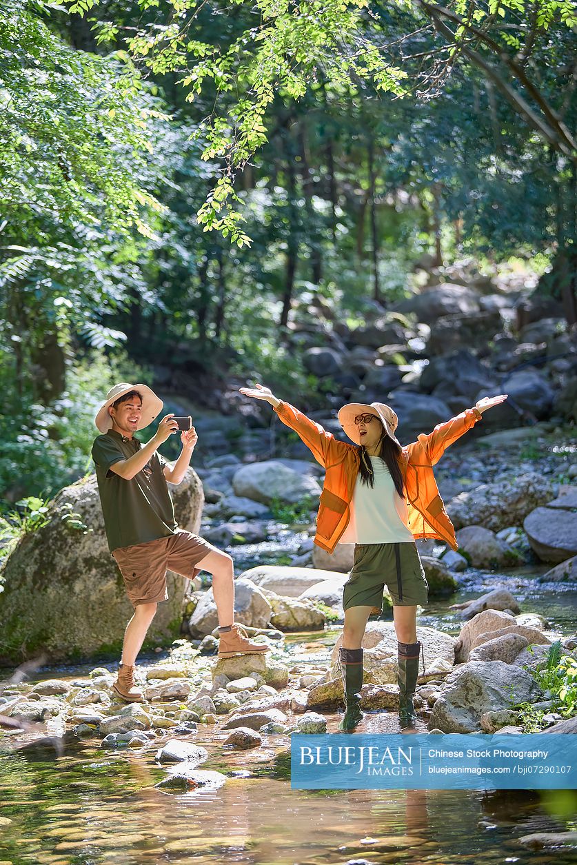 Happy couple hiking through the serene beauty of nature