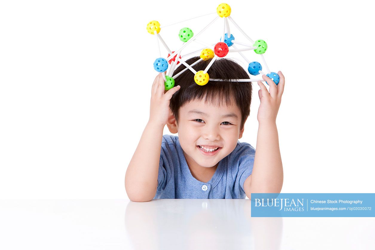 Chinese boy playing universal ball