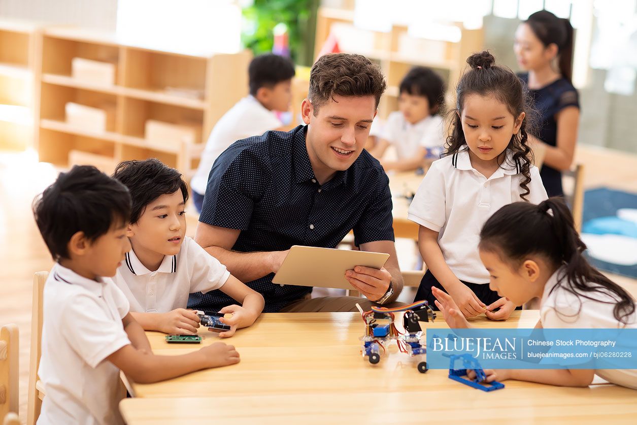Children learning coding in classroom