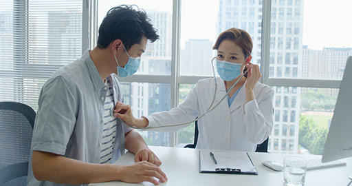 Chinese doctor using stethoscope to examine patient,4K