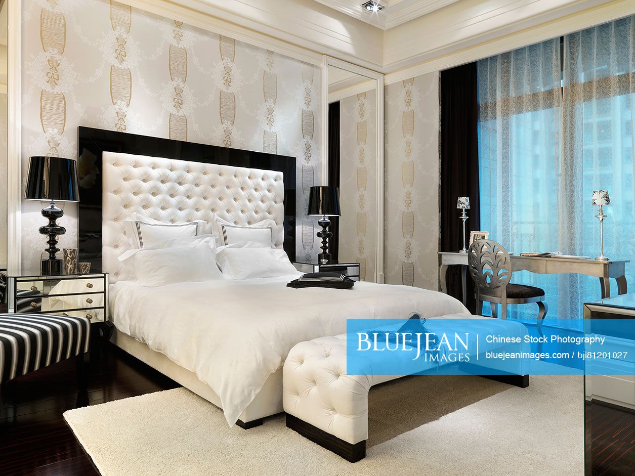 White bed in elegant master bedroom