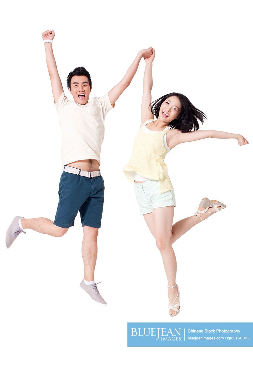 Portrait of cheerful young Chinese jumping