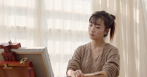 Young Chinese woman painting at home,4K