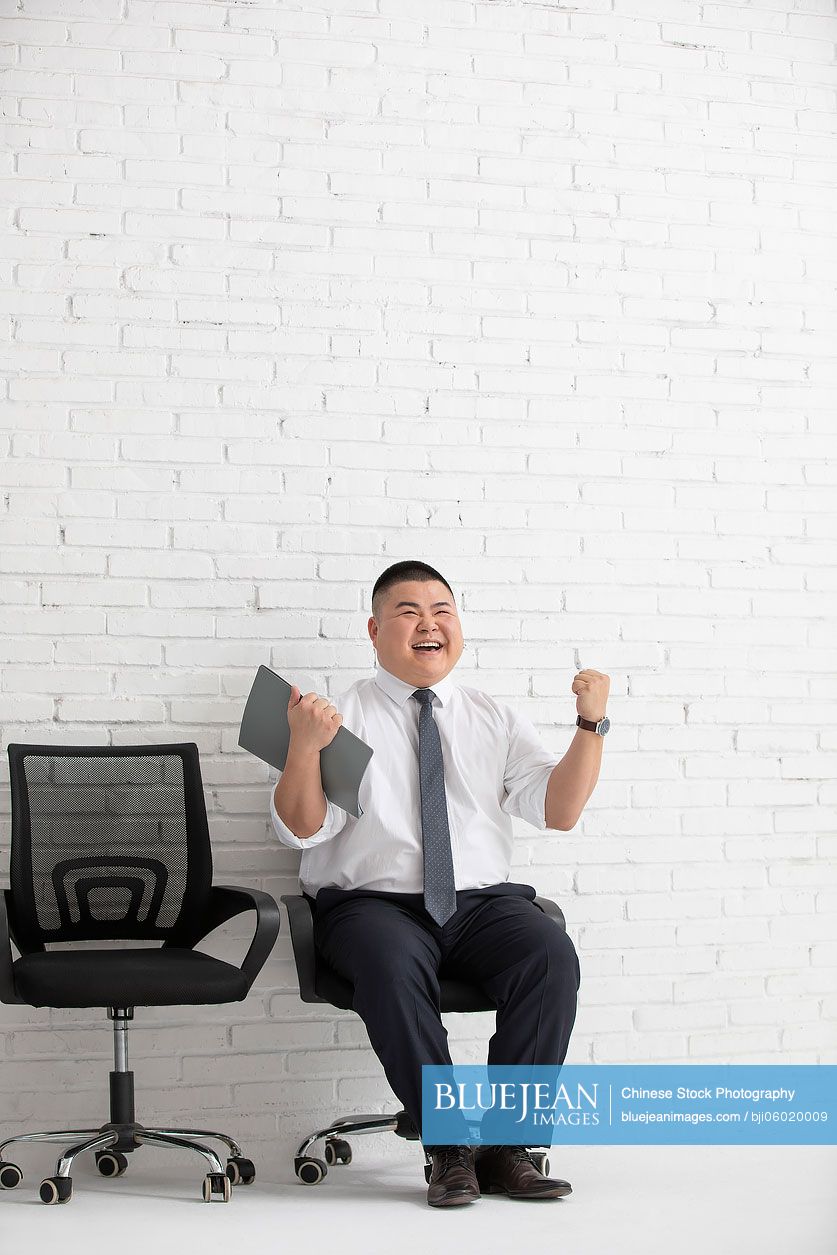 Young Chinese businessman waiting for job interview