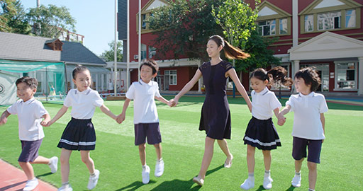 Chinese teacher and students in kindergarten playground,4K