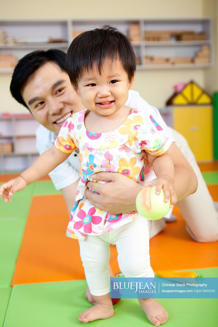 Chinese father playing with daughter