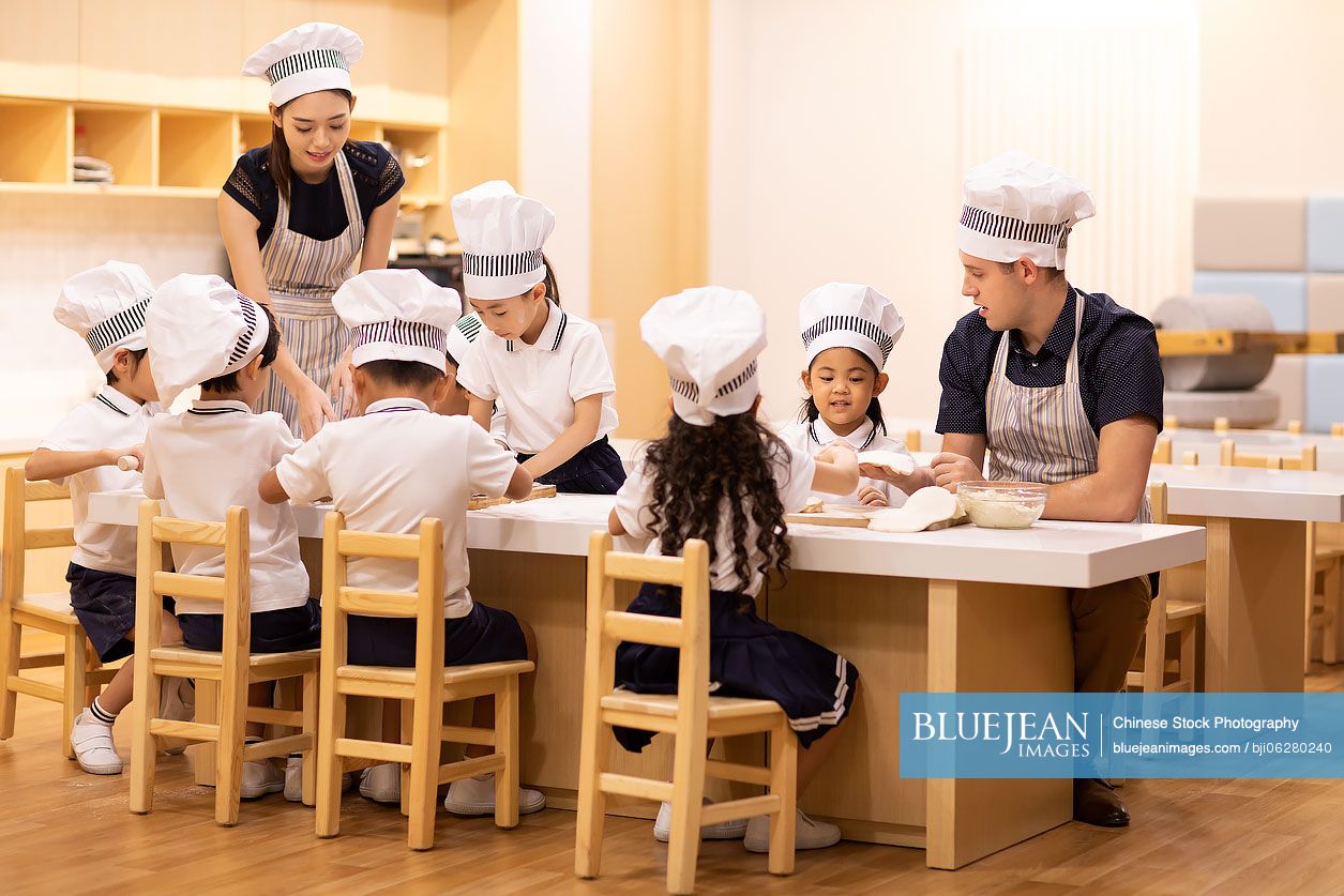 Children learning cooking in classroom