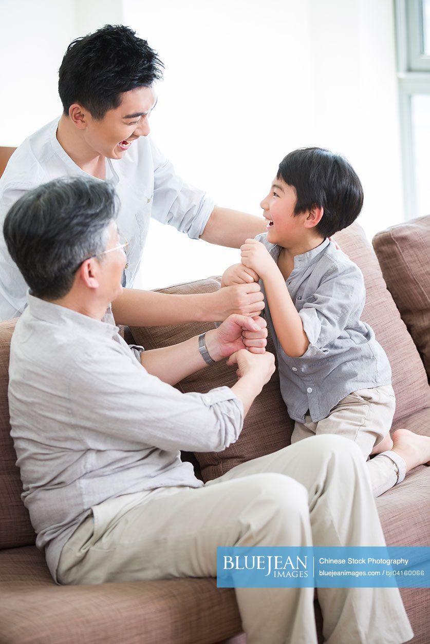 Cheerful Chinese family playing games