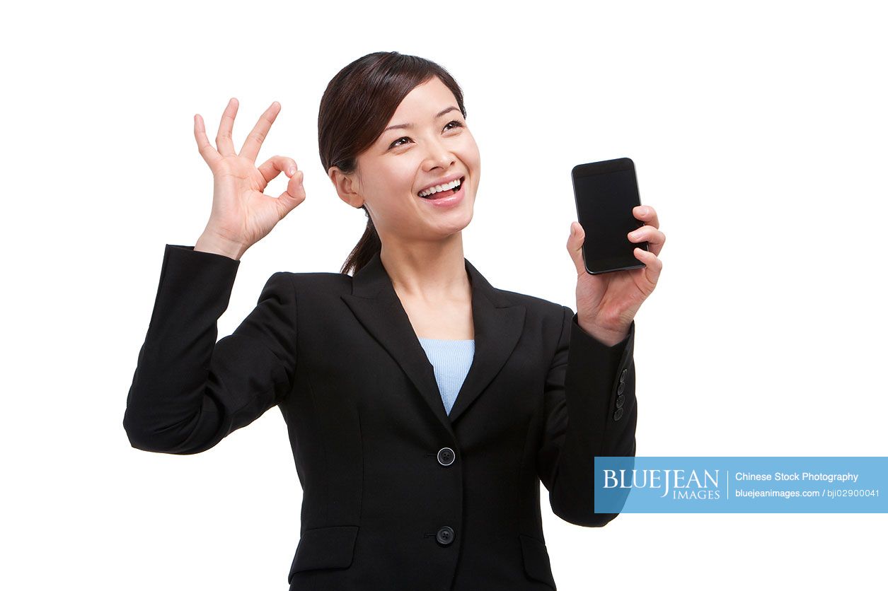 Chinese businesswoman showing mobile phone