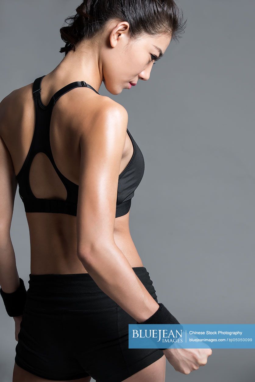 Rear view of young Chinese female athlete