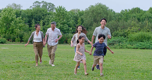 Happy Chinese family running on grass,4K