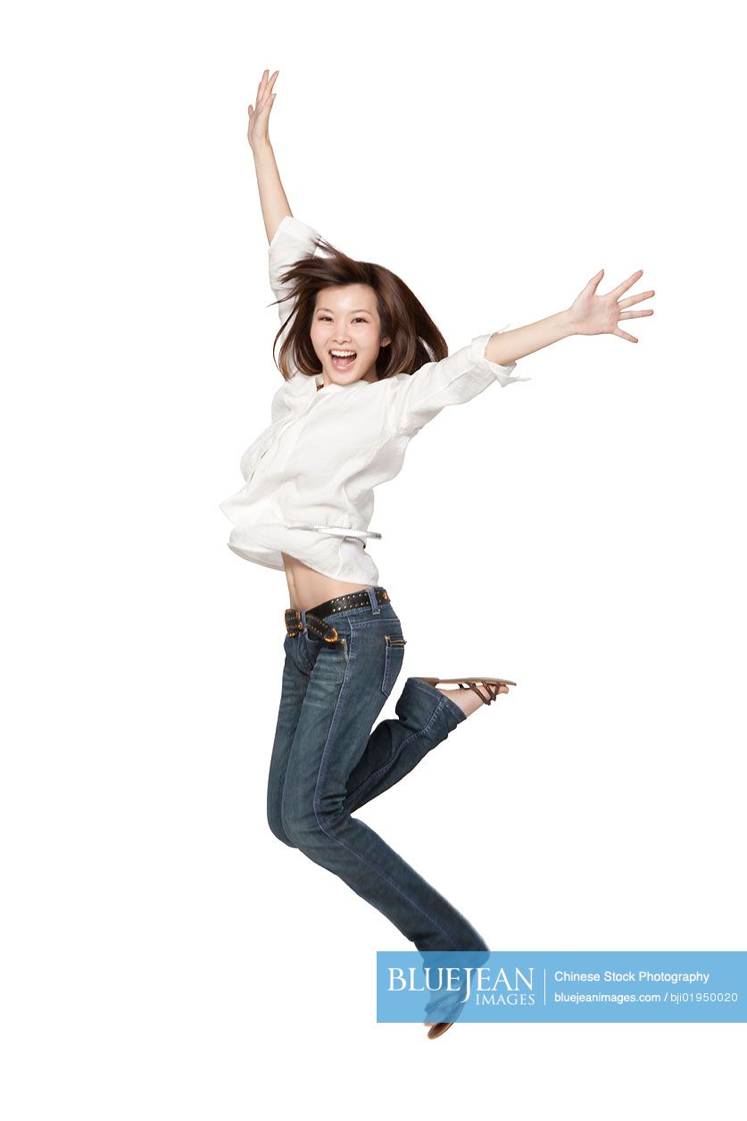 Portrait of young Chinese woman jumping