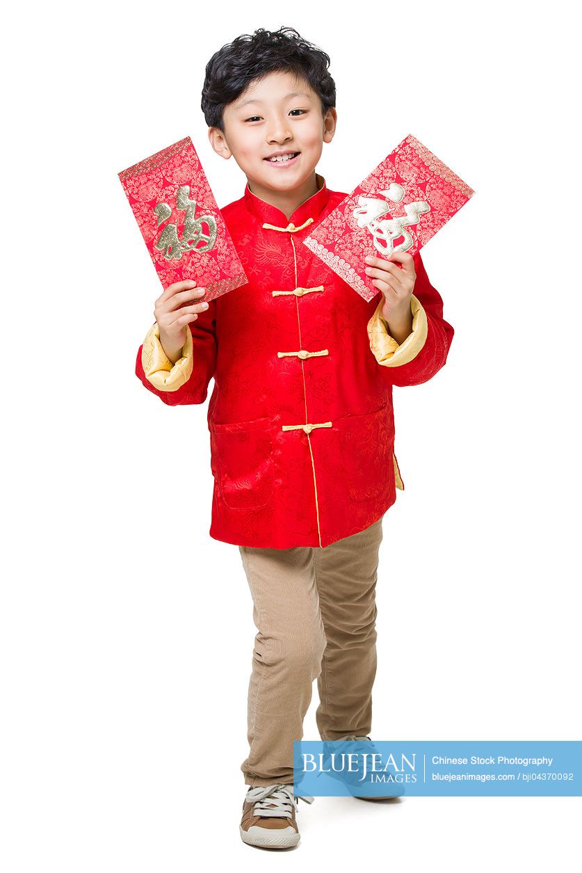Happy Chinese boy holding two red envelopes